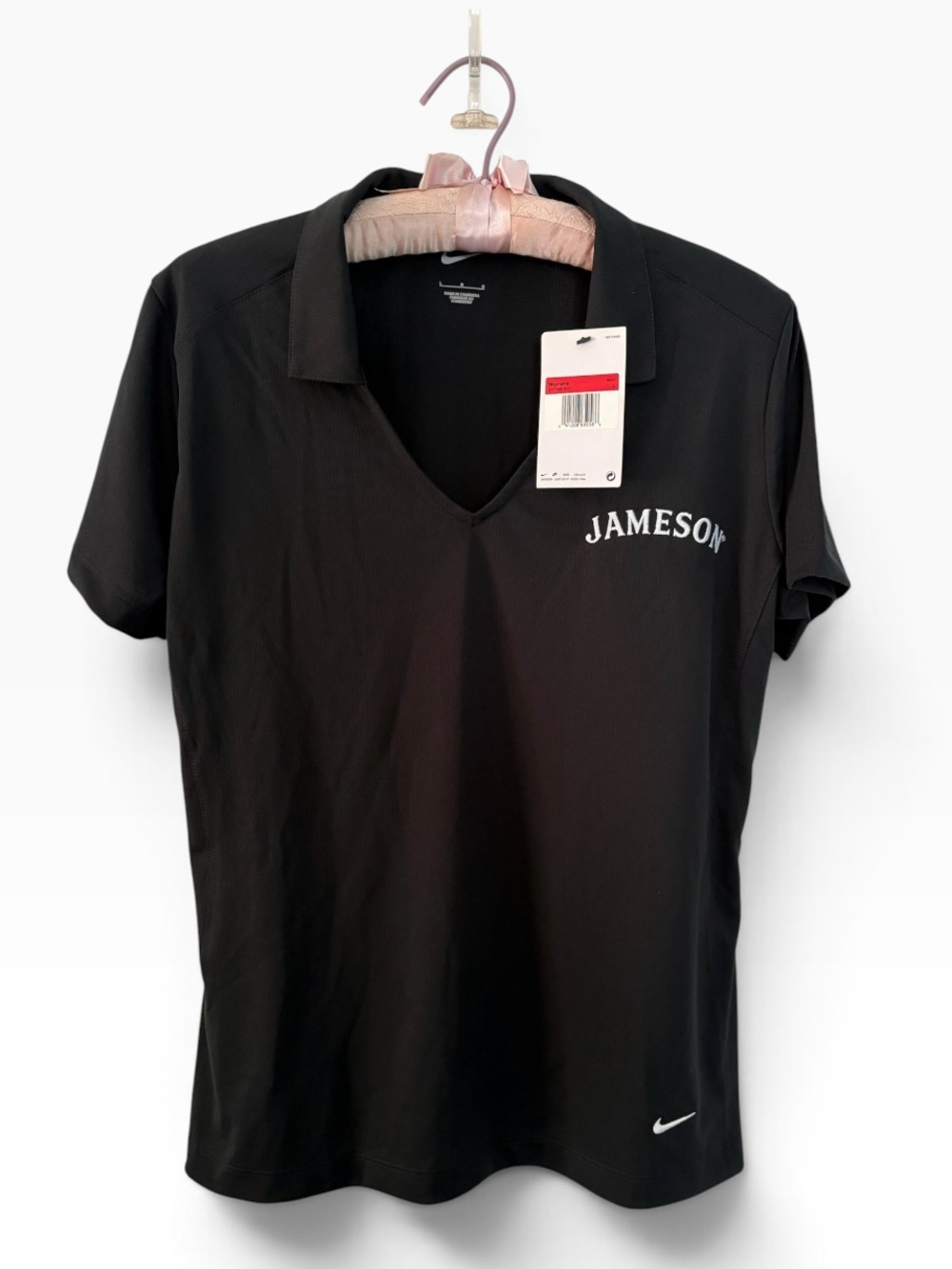 Nike Woman’s Golf Shirt with Jameson logo. New with tag.